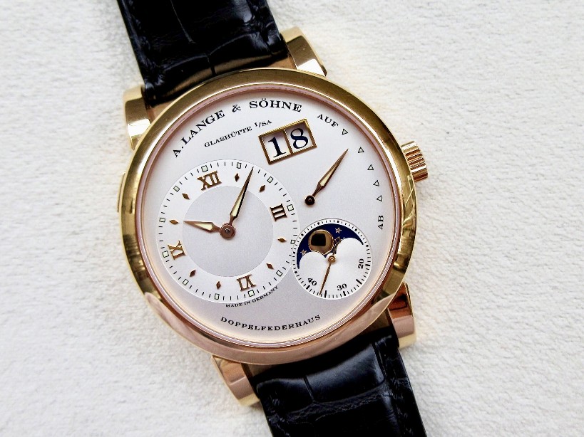 The off-centred dial fake watch has moon phase.